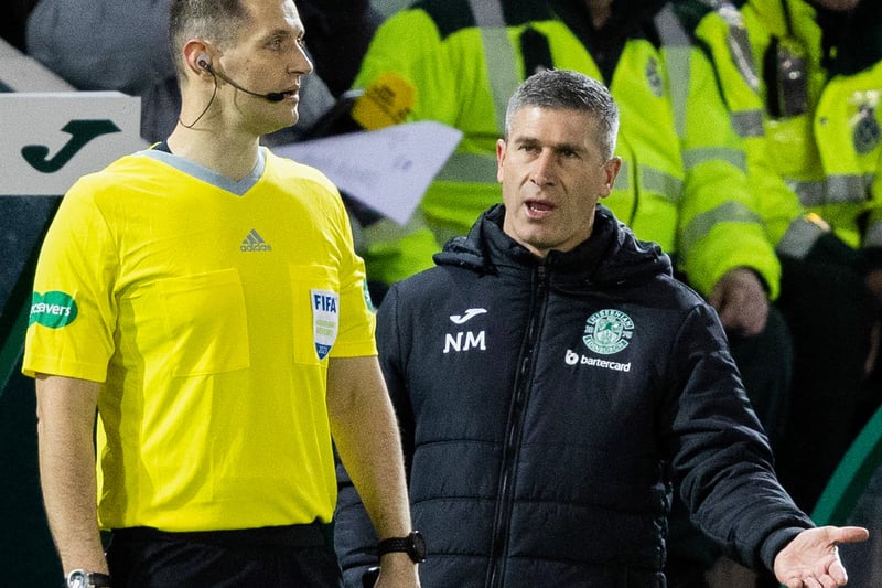 Hibs boss Nick Montgomery questions the linesman in the first half.
