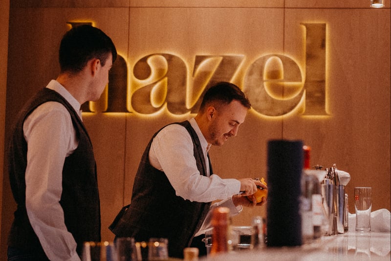 Members of the Hazel team at work behind the luxurious bar