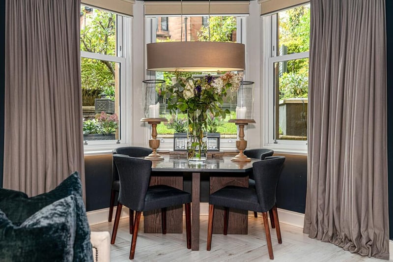 There is space in the bay window for a dining table with great leafy views. 