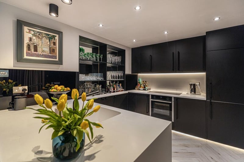 The re-fitted kitchen has  extensive units and quality Corian worktops. 