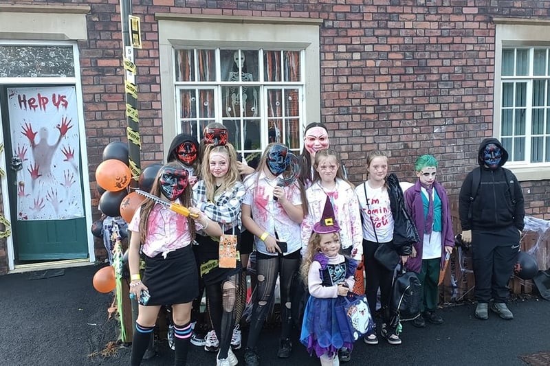 Ashleigh Pookie Morley shared this photo of a party of 10 outside a house of horrors.