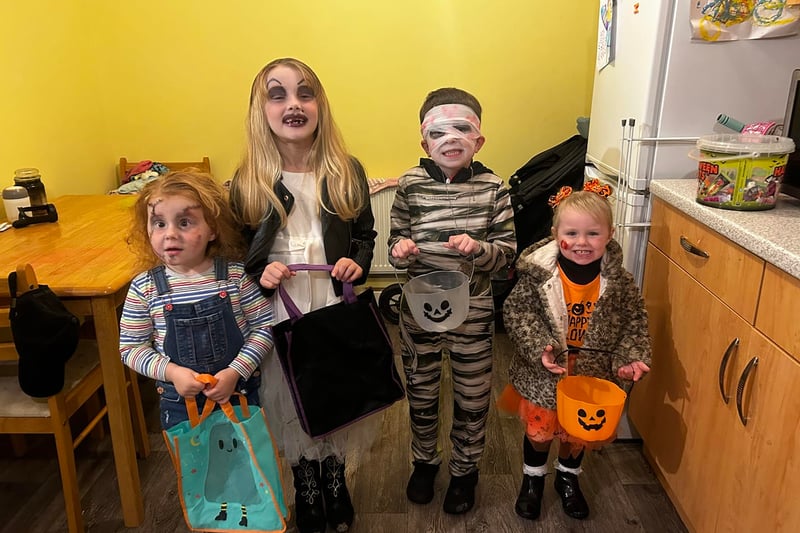 Emma Ward shared this photo of a four ghoulish kids in costume - I count Chucky, Bride of Chucky, a mummy and a classic orange Halloween dress.