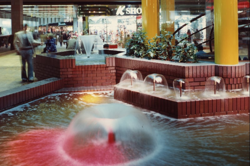 A view of the interior of Eldon Square Shopping Centre Newcastle upon Tyne taken in 1976. The photograph shows the fountains at the base of the dome containing Bainbridge’s cafe. Shops can be seen in the background. (Newcastle Libraries)