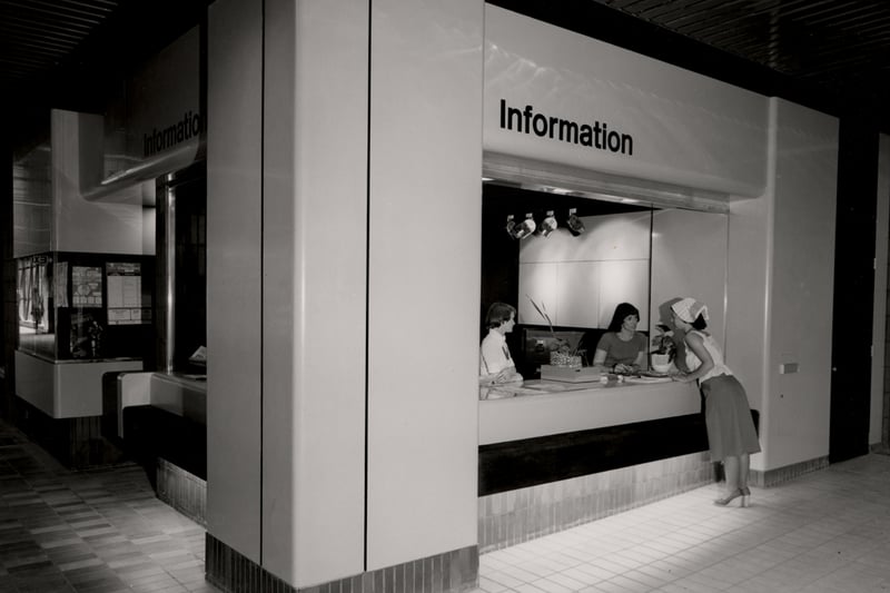 A view of the interior of Eldon Square Shopping Centre Newcastle upon Tyne taken in 1976. The photograph shows the Information desk. (Newcastle Libraries)