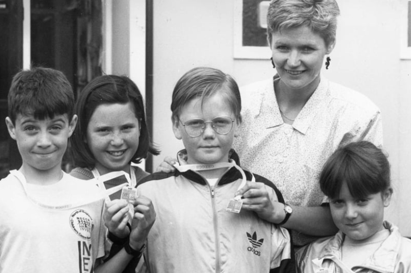 Inspecting the medals awarded to Whitburn Junior School pupils, who completed the Gosforth Fun Run in aid of the Royal Victoria Infirmary, is children's cancer unit nurse specialist, Diane Barstow. Also pictured are Paul Bailey, Cirk Newton, Kay McQuire and Laura McIver. Photo: Shields Gazette