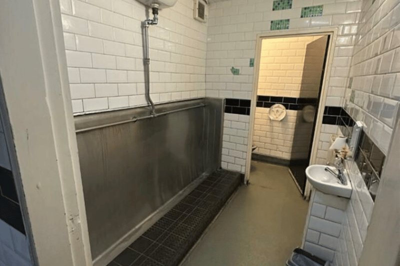 The men’s toilet comes complete with a urinal, sink and separate stall.