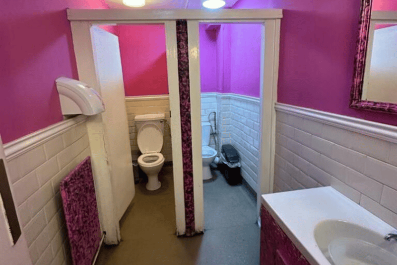 The women’s toilet features two stalls for customers.