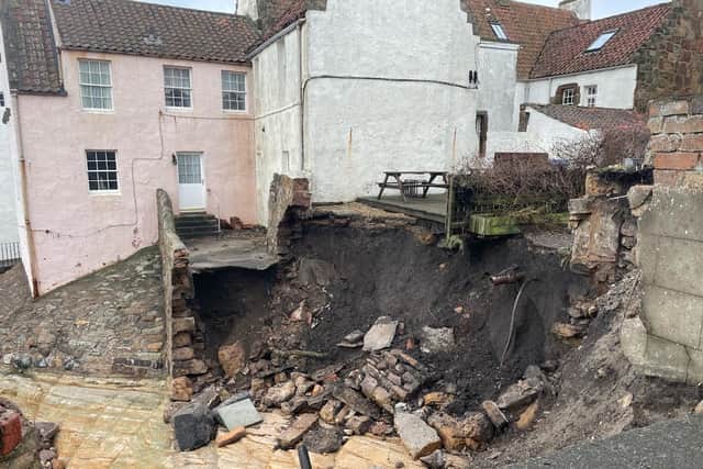 A Pittenweem man has had a lucky escape after a seafront walkway in the picturesque coastal village disintegrated beneath his feet following wild weather and exceptionally high tides last weekend, plunging him into a giant hole which had opened up.

