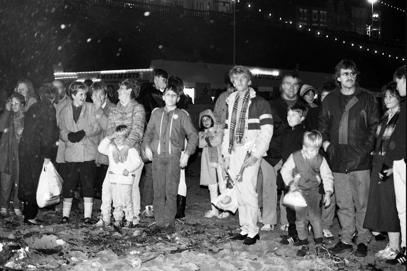 The crowd on Roker beach getting warm from the bonfire while watching the display in 1986.