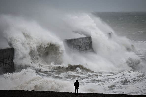 Waves crash the harbour wall in Newhaven, southern England on November 2, 2023, as strong winds and heavy rain from Storm Ciaran hit Britain. (Photo by GLYN KIRK/AFP via Getty Images)