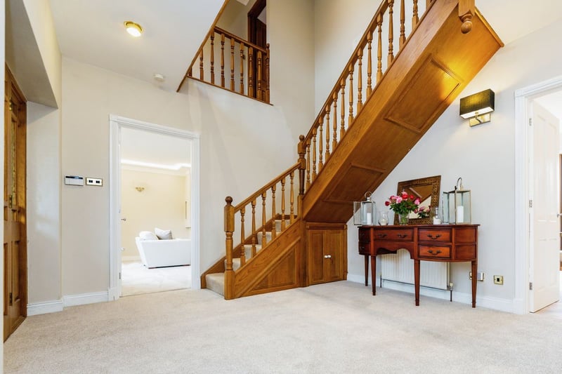 The entrance hall features this rather grand looking staircase. (Photo courtesy of Purplebricks)