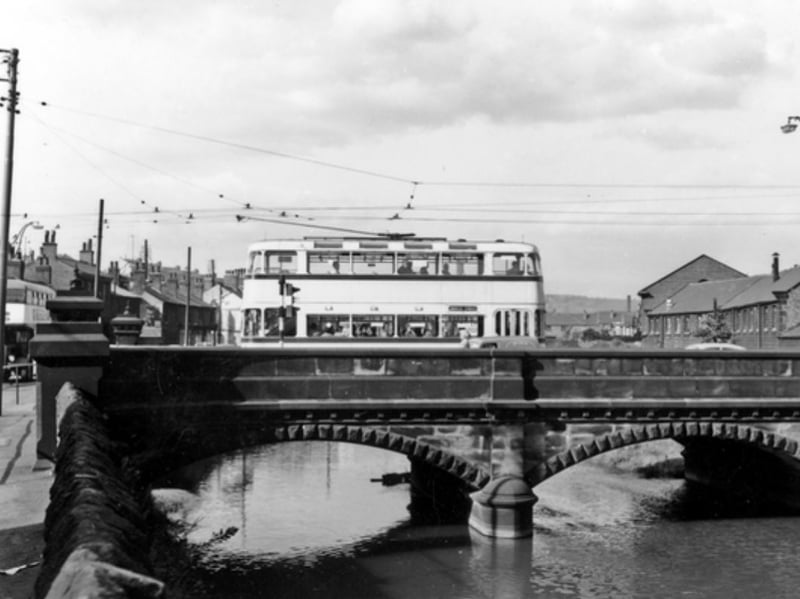 A tram crosses Hillfoot Bridge, on Penistone Road, in Neepsend, Sheffield, some time during the 1940s or 50s. Photo: Picture Sheffield