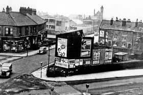 The junction of Penistone Road and Bradfield Road, Owlerton Green, in October 1958, showing W.R. Swann and Co. Ltd Surgical Instruments Manufacturers in the background. The tower belongs to St John the Baptist Church. Photo: Picture Sheffield
