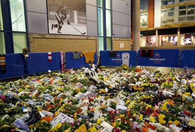 Floral tributes outside the Motorpoint Arena, Nottingham. Photo: Zac Goodwin/PA Wire.