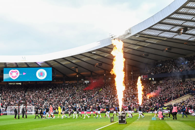 Flares and flames aplenty as the squads walk out on to the pitch.