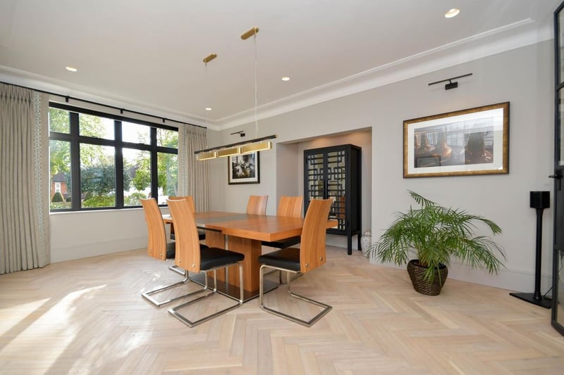 The dining room is to the front of the house, and has glazed doors through to the open-plan living/kitchen area. 