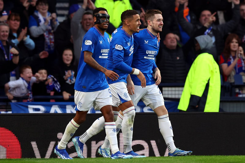 Scott Wright of Rangers celebrates with team mates Danilo and James Tavernier after scoring his side’s second goal against Hearts.