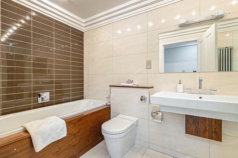 Main family bathroom comprising bath, separate shower cubicle, toilet and wash hand basin. 