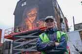 Elle Koziupa with her London Road mural of Joan of Arc
