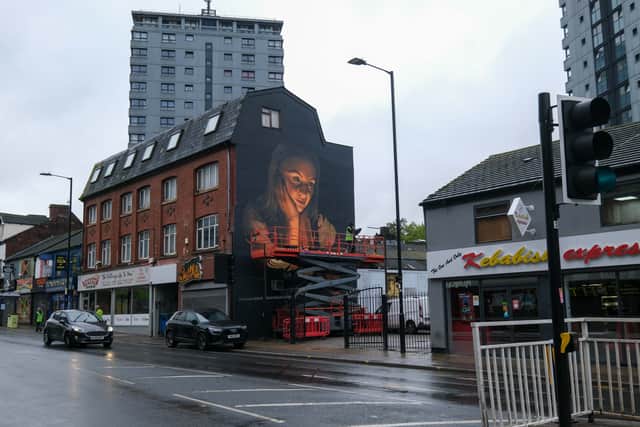The mural is on the side of the building, at 66 London Road.