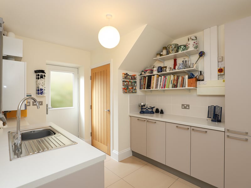 The utility room can provide entry and exit to the rear garden. (Photo courtesy of Redbrik)