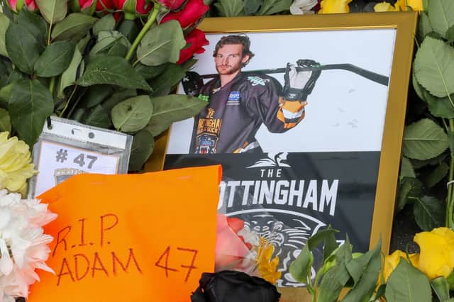 Fans pay their respects and lay floral tributes at the Motorpoint Arena, Nottingham, after Nottingham Panthers ice hockey forward Adam Johnson died after suffering a serious cut to his neck from a skate during Saturday's Challenge Cup match against the Sheffield Steelers.  Picture: Anita Maric / SWNS