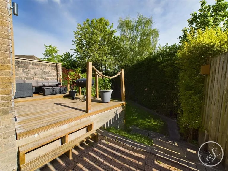 A decked terrace also sits in the enclosed garden.