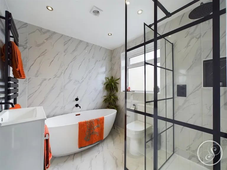 A stunning four-piece with a freestanding bath and a walk-in shower.