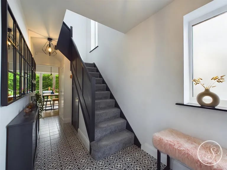 A welcoming bright hallway welcomes you into this property.
