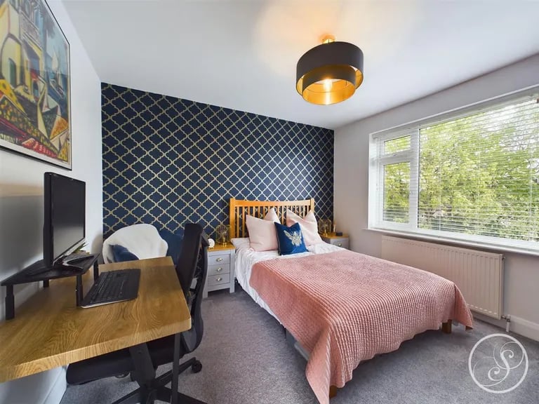 The bright second bedroom is a double.