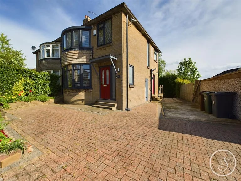 To the front of this Meanwood property is a large driveway.