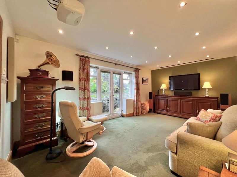 This TV room is a comfortable environment to enjoy some down time. (Photo courtesy of Zoopla)