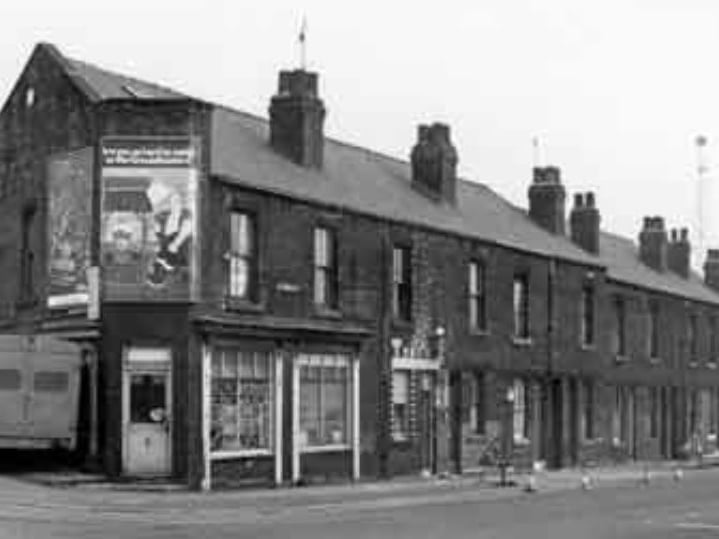 Terraced housing on (right) Upwell Street, at the junction with Carlisle Street East, showing (centre) Tony's barbers, some time between 1980 and 1999
