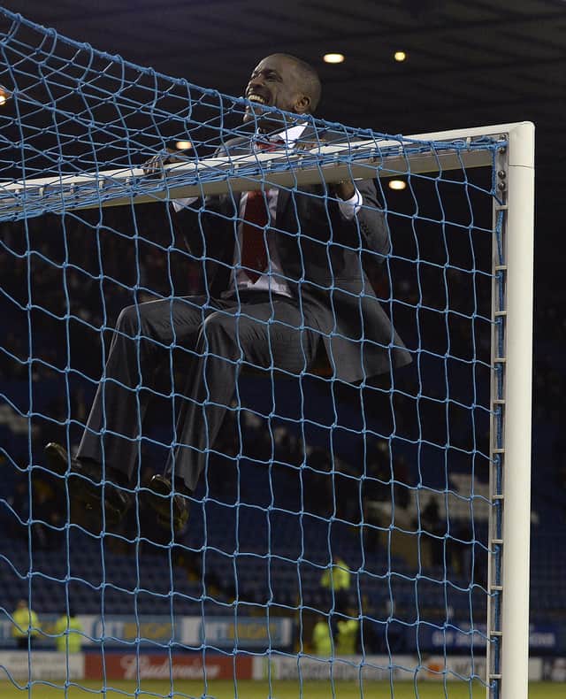 Chris Powell hangs from the crossbar at Hillsborough after Charlton Athletic beat Sheffield Wednesday in the FA Cup