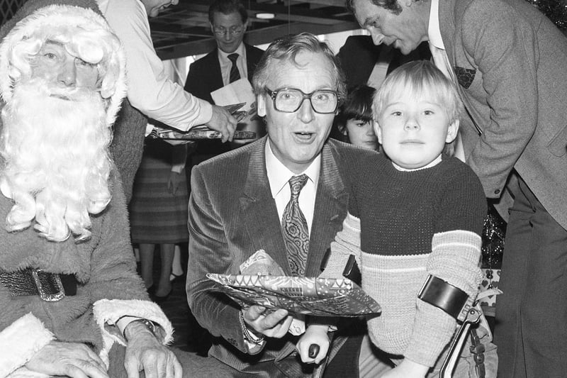 Empire panto star Nicholas Parsons helped out Santa at the 1980 party for 80 youngsters in Joplings.
It was held in the store's restaurant.
