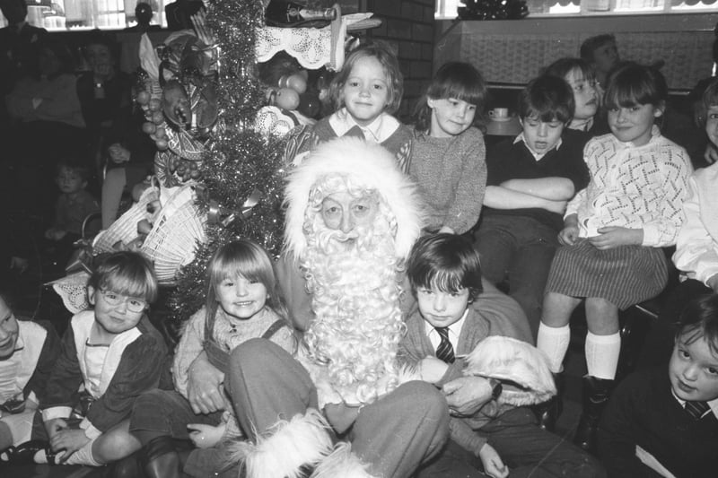 Gathered round the Christmas tree with Father Christmas 37 years ago.
