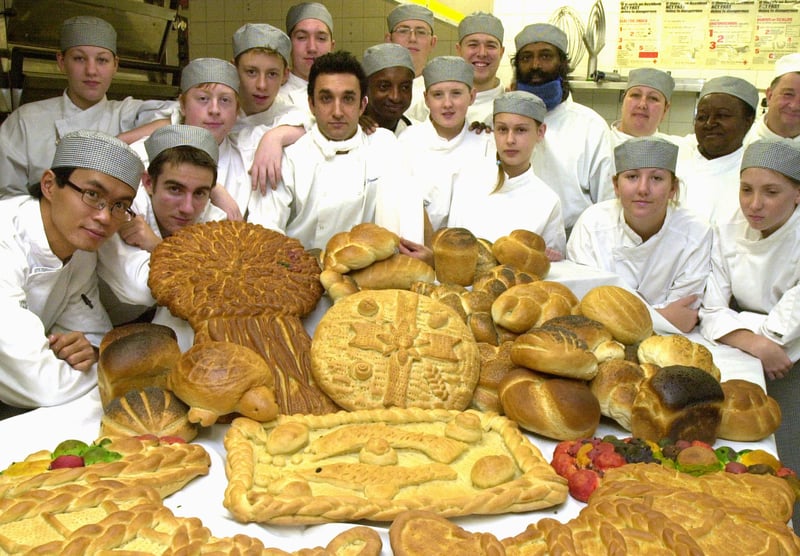 Tutor Chris North and Jose Fernandez pictured with first Year bakery students at The Sheffield College with bread they baked for the traditional Harvest Festival at Sheffield Cathedral in 2003