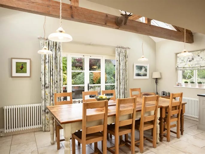 The dining area with exposed wood beam.
