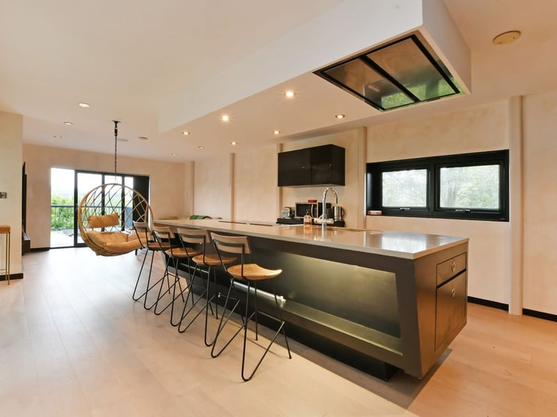 The open plan kitchen/living room acts as the heart of this interesting home. (Photo courtesy of Zoopla)