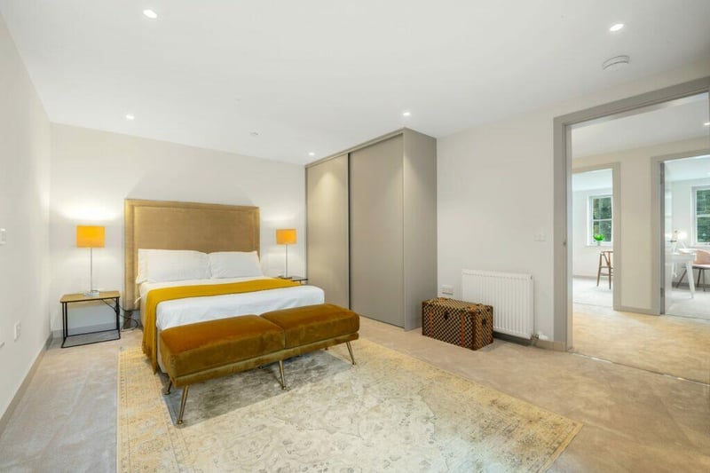The principal bedroom features built in wardrobes, an en suite bathroom and balcony. 