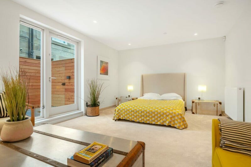 Bedroom four/family room has French doors to the private courtyard garden. 