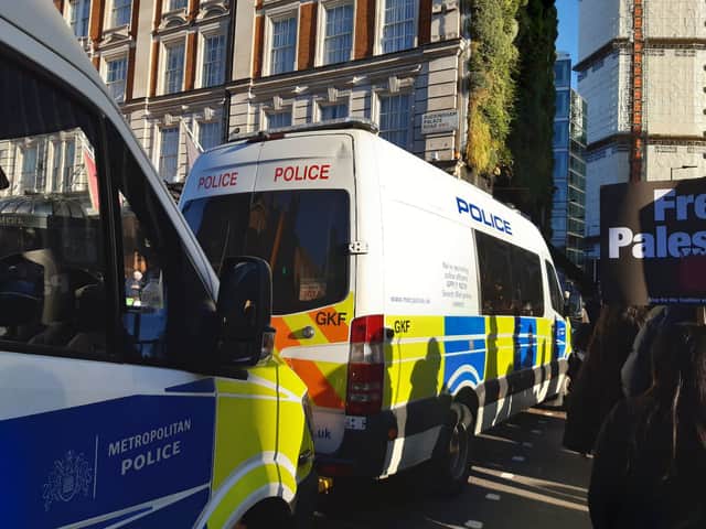Pro-Palestine march: Met Police vehicles blockade the road to Buckingham Palace along the march route