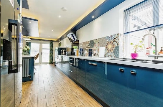 Another shot of the kitchen shows the French doors leading to the garden. Pic: Purplebricks