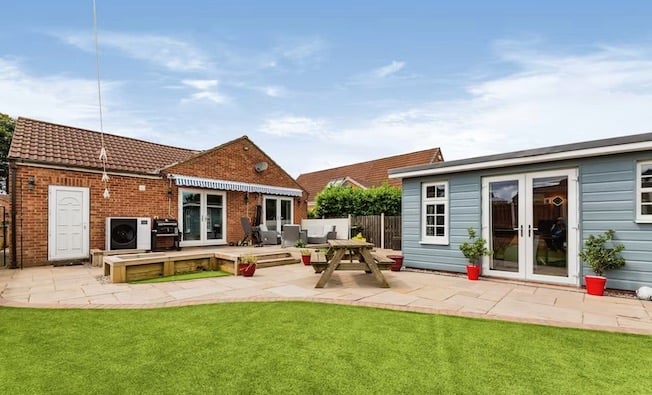 The garden has a lawn as well as a patio with an awning. Pic: Purplebricks