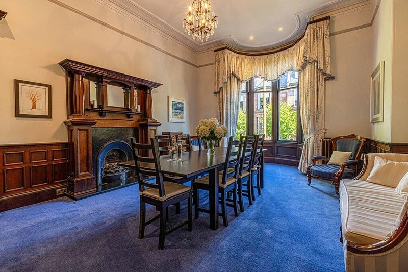 The formal dining room has a four section bow window to the front with a substantial fireplace. 