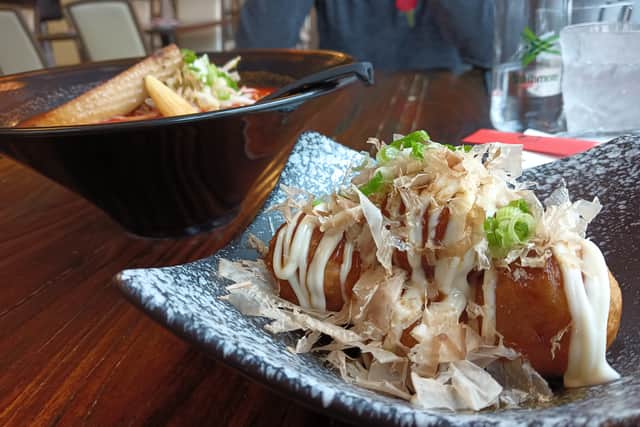 This is takoyaki - friend batter balls with seafood in the middle, served with Japanese mayonnaise and bits on top. This plate of six was eaten by the two of us in under a minute because they were so good.
