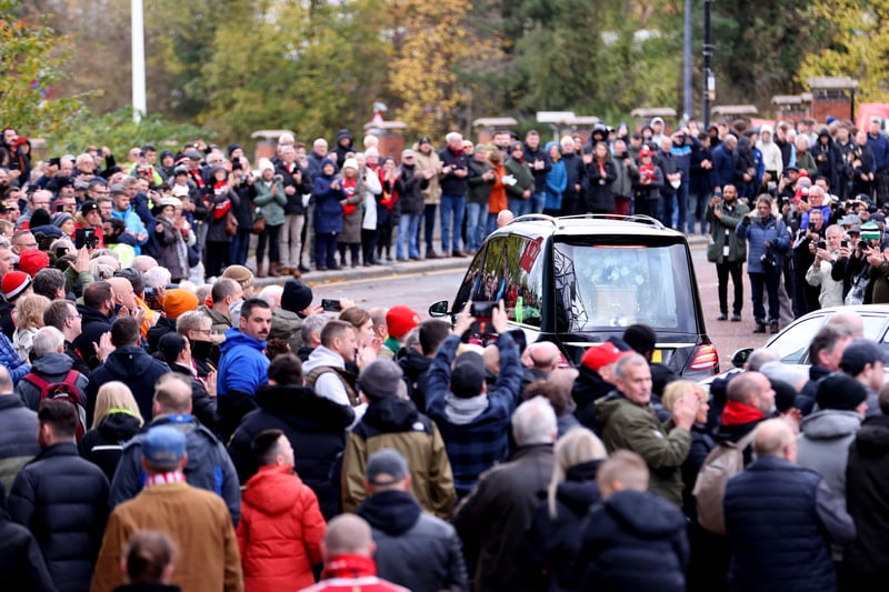 The funeral procession goes past Old Trafford