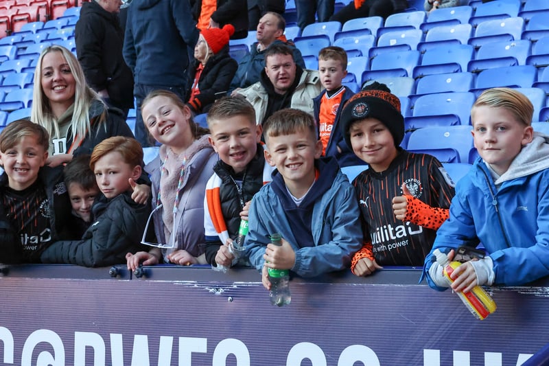 Young Blackpool fans go right to the front to pose for the camera. 