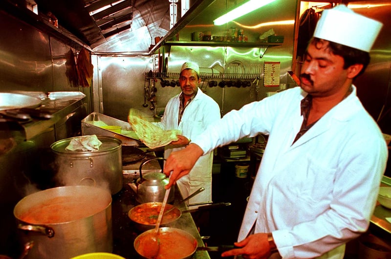 Chefs Kabir Hussain Qazmi and Mazhar Iqbal in the kitchen at the Mangla Indian restaurant and takeaway in Spital Hill, Sheffield