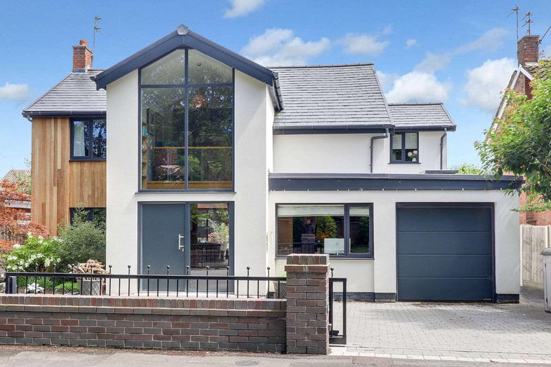 The front of the house is stylishly modern and the property is situated on a prestigious tree lined road.
